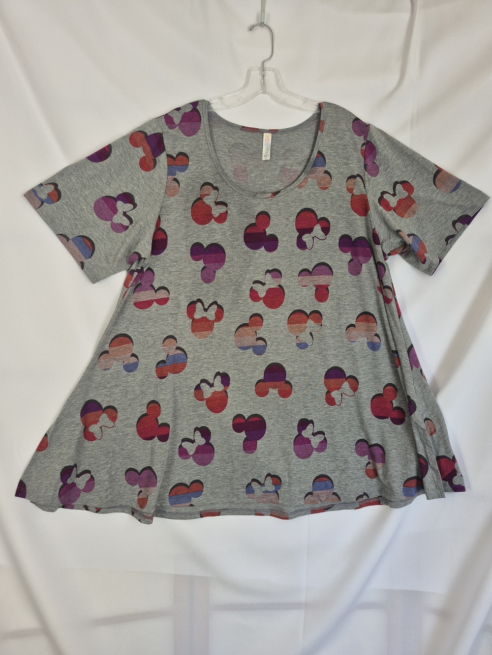 LuLaRoe Disney short-sleeve top featuring an all-over colorful Mickey and Minni